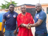 Founder of UEN in a handshake with the king of Abeka at the community clean up and disinfection of of the abeka market and its environs.